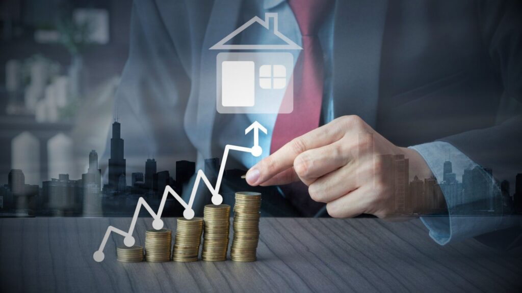 A suited man points to a house atop coins. Image represents a commercial property letting agents discussing renting a flat